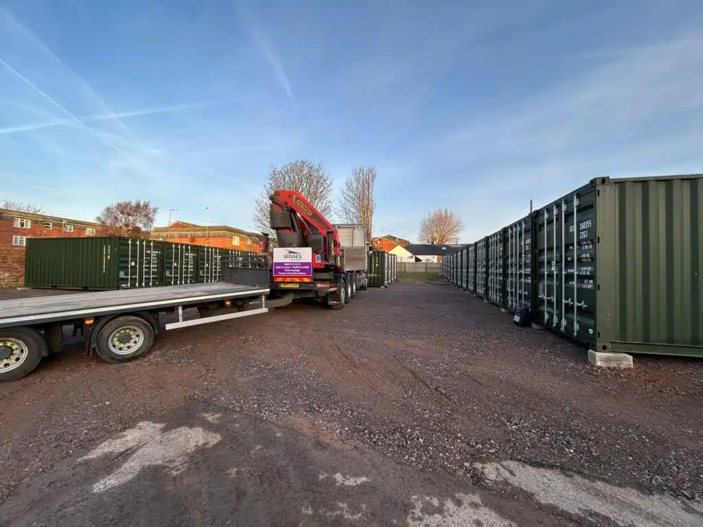 Set of Shipping Containers set up with a hiab in a row